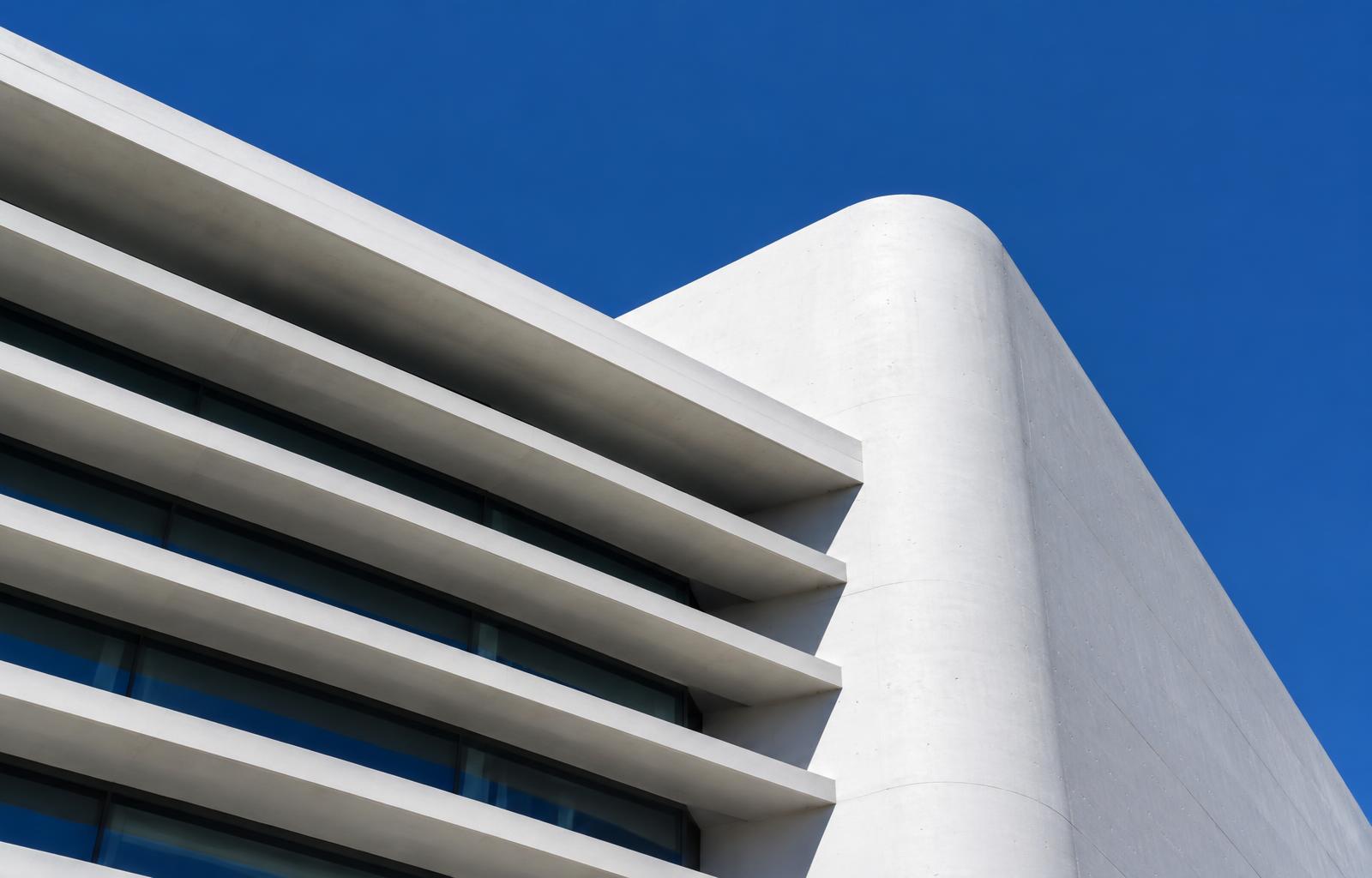 Sculptural white architecture against a clear blue sky